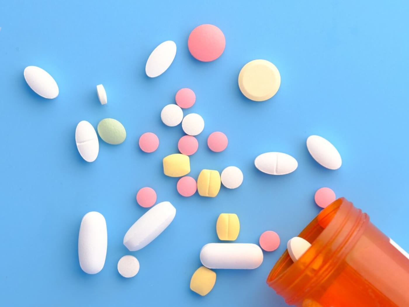 Pharmaceutical production line with sealed vials on a stainless steel conveyor