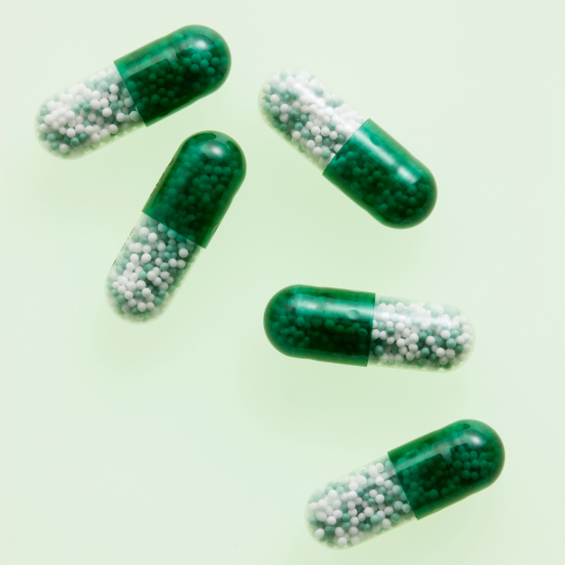 Capsules filled with coated granules