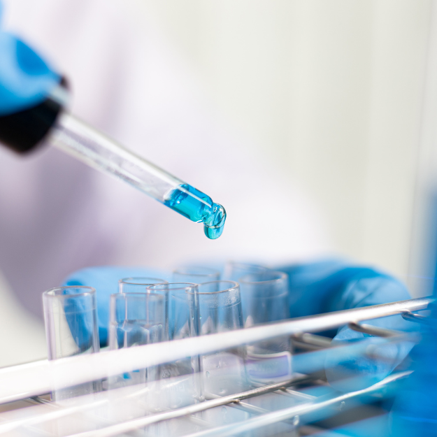 Pipette dispensing liquid during laboratory analysis